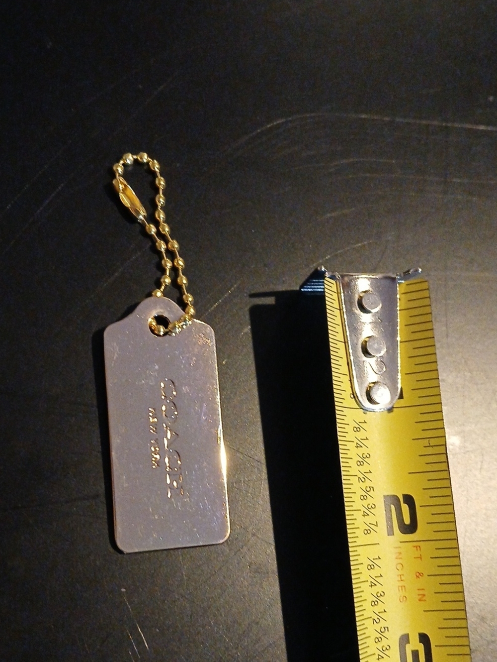Gold Metal Bar Coach Hangtag